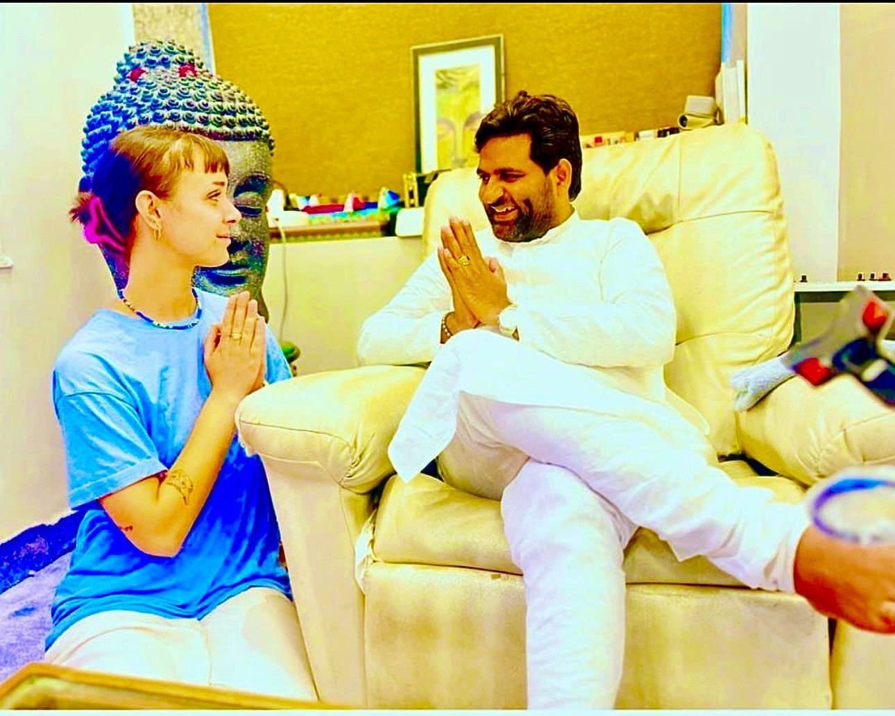 Dr. D.P. Shukla and a young visitor greeting each other with joined palms
