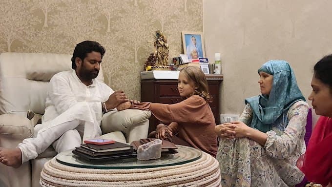 Dr. D.P. Shukla reading for a family
