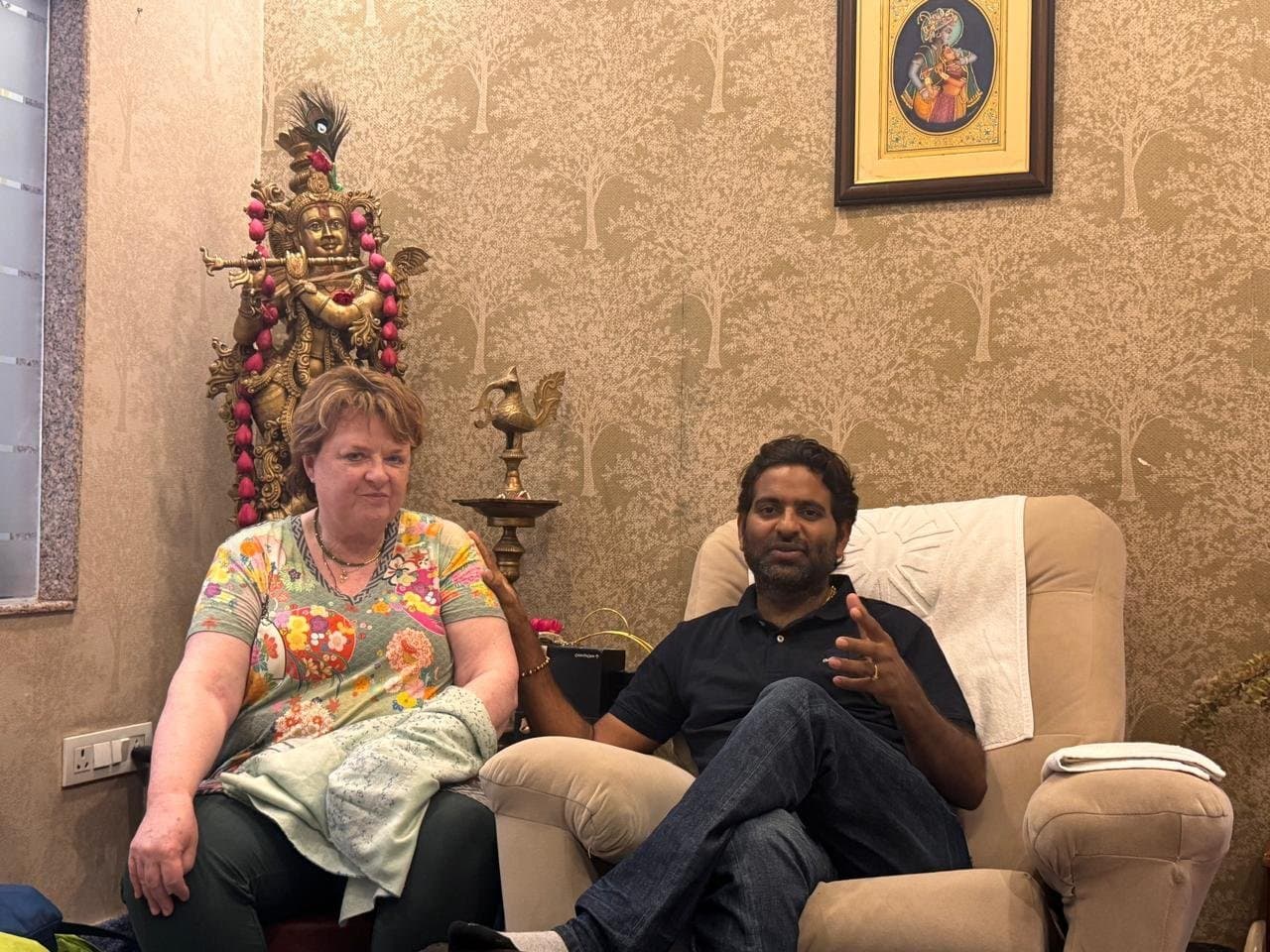 A visitor in conversation with Dr. D.P. Shukla in his study