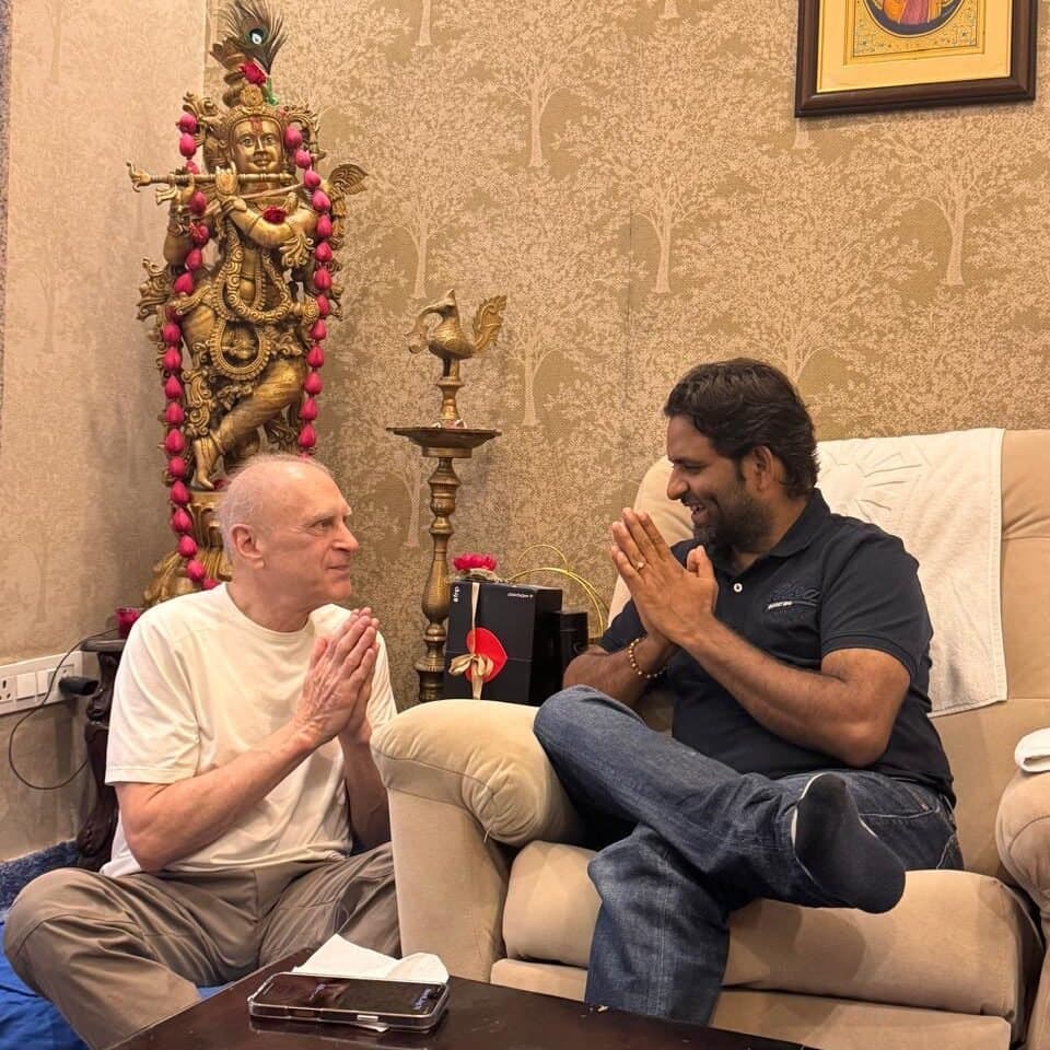 A visitor greeting Dr. D.P. Shukla with joined palms