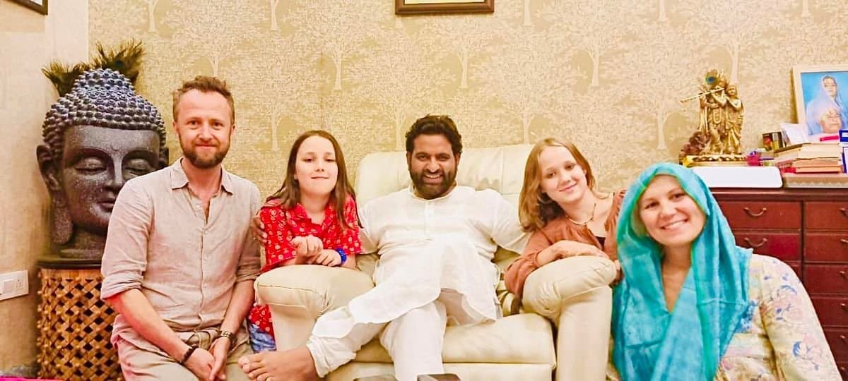 A family of visitors seated with Dr. D.P. Shukla